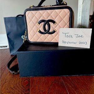 Chanel Vanity case beige and black.  Gently used with no markings on exterior